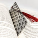 a book with a red tassel on top of it