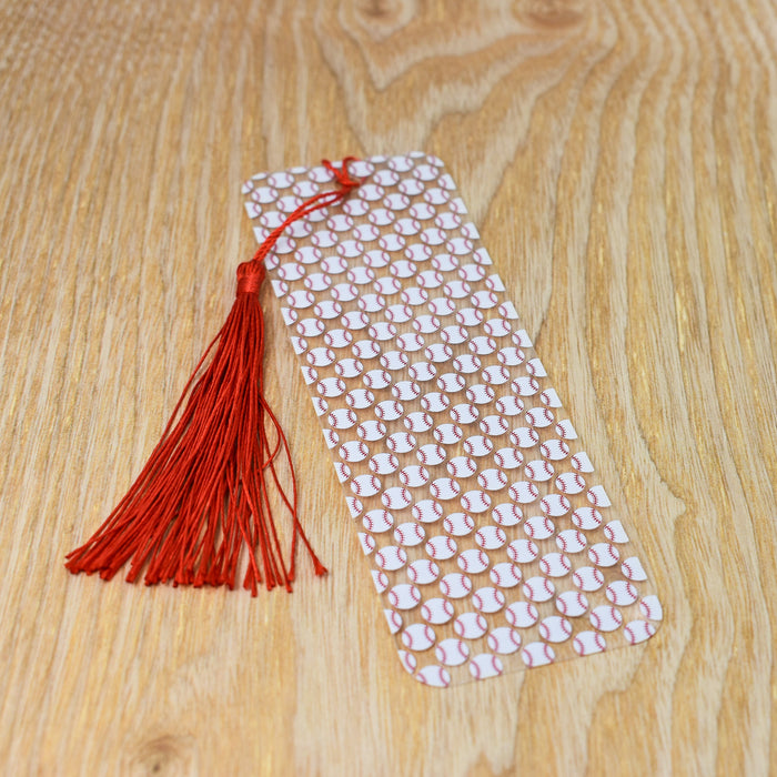 a white tie with a red tassel on a wooden table