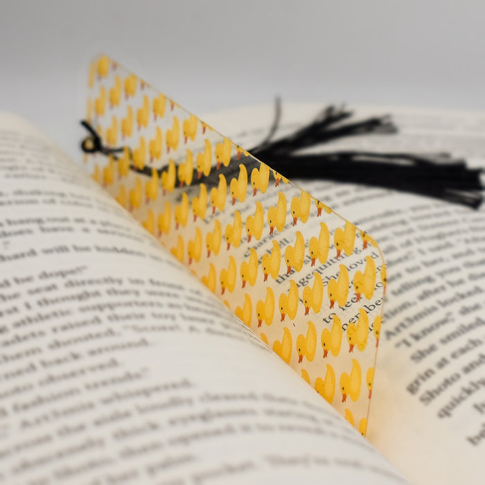 an open book with a yellow and black bookmark