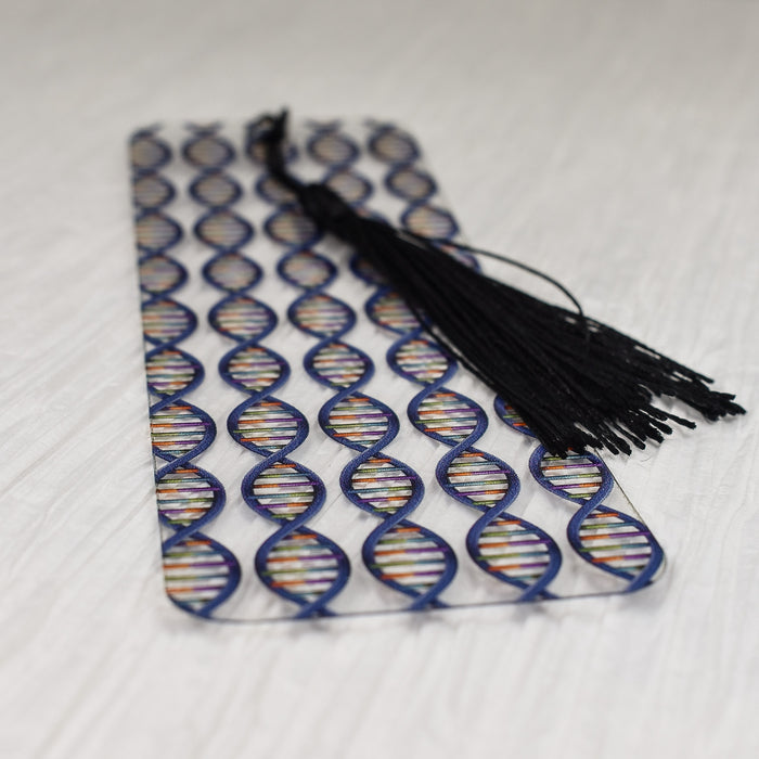 a pair of black tassels sitting on top of a white table