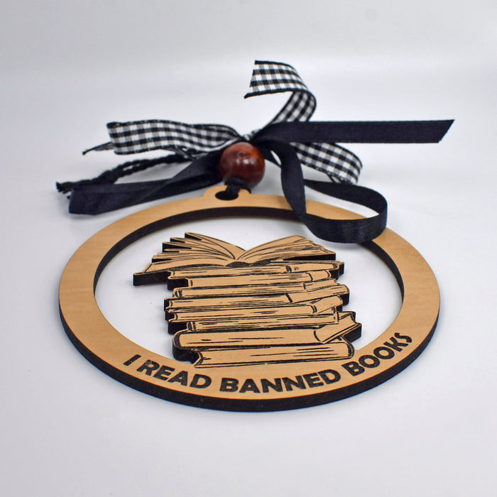 a wooden ornament with a stack of books on it