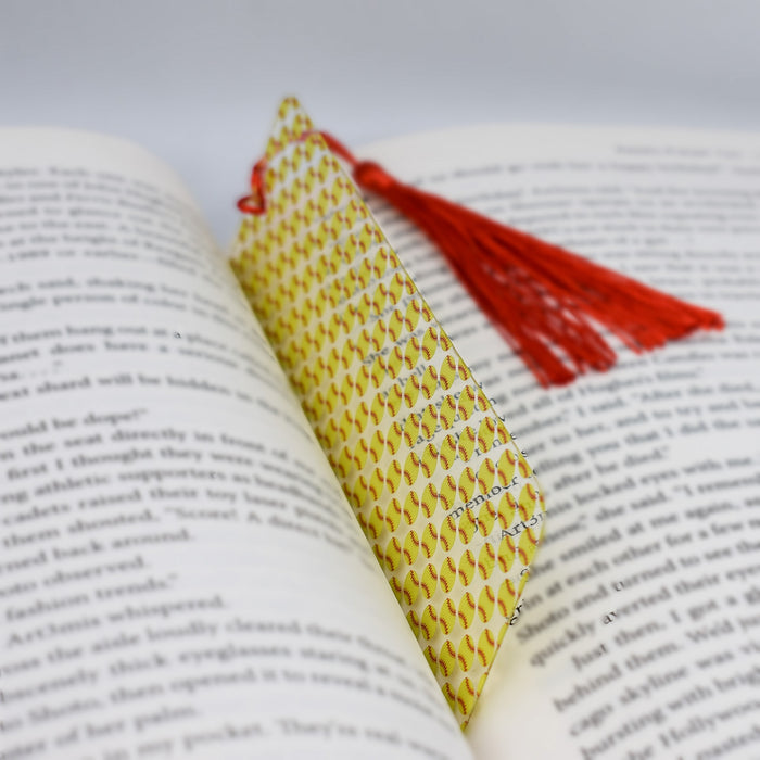 a book with a red tassel on top of it