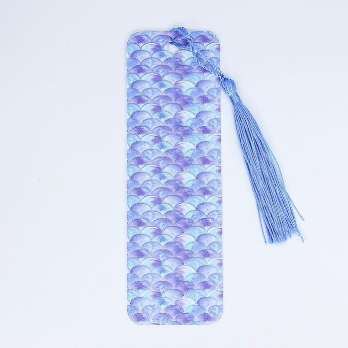 a purple and blue tie laying on top of a white table