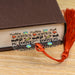 a close up of a book with a tassel on top of it