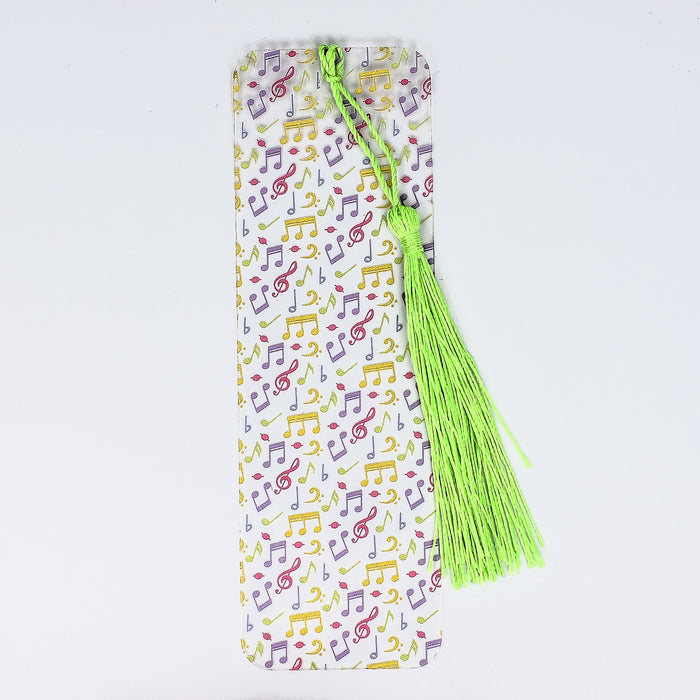 a bookmark with a green tassel on top of it