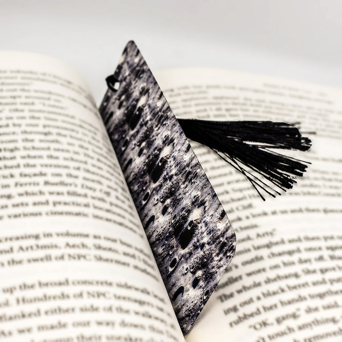 a book with a tassel on top of it