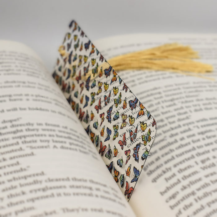 a book with a bookmark made out of butterflies