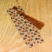 a wooden table topped with a tie on top of a wooden table