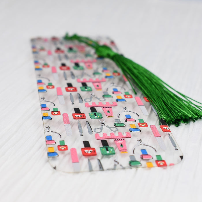 a piece of paper with a green tassel on top of it