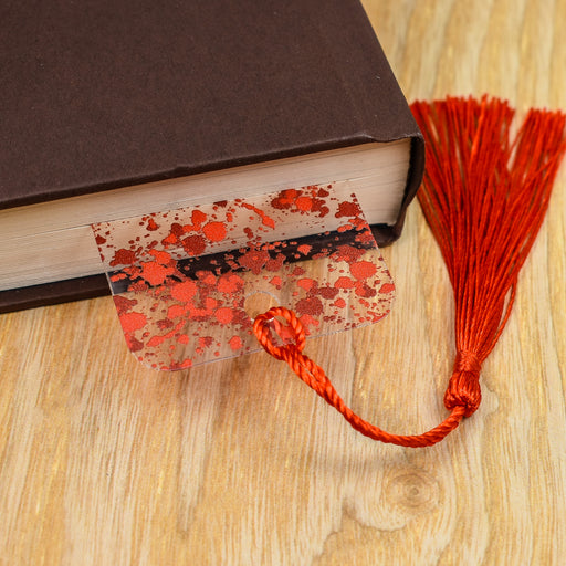 a book with a tassel on top of it