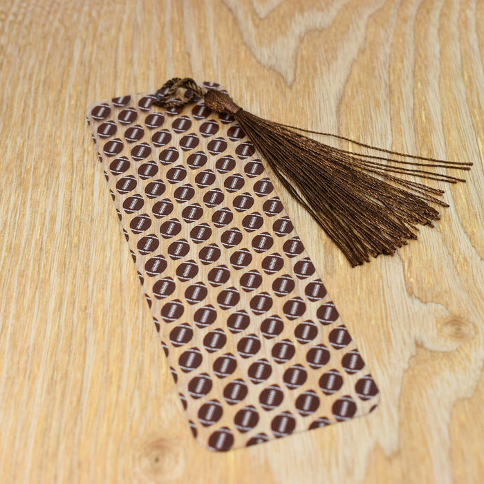 a tie on a wooden table with a tassel