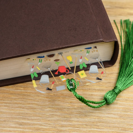 a book with a green tassel on top of it