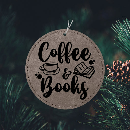 a coffee and books ornament hanging from a christmas tree