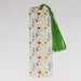 a bookmark with a green tassel hanging from it