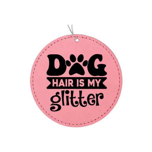 a pink leather tag with a dog's hair is my glitterer on it