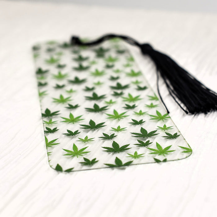 a green and white bag with marijuana leaves on it