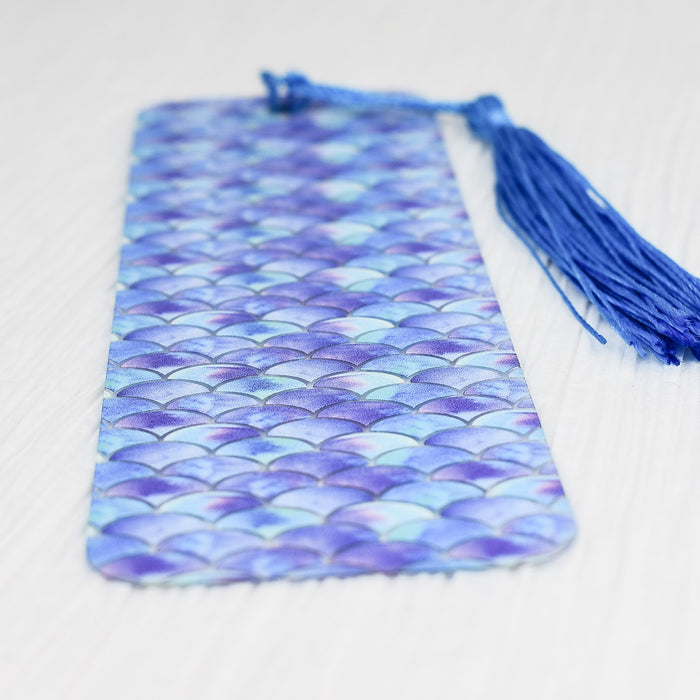 a purple and blue tie with a tassel