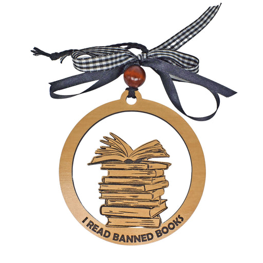 a wooden book ornament with a ribbon around it