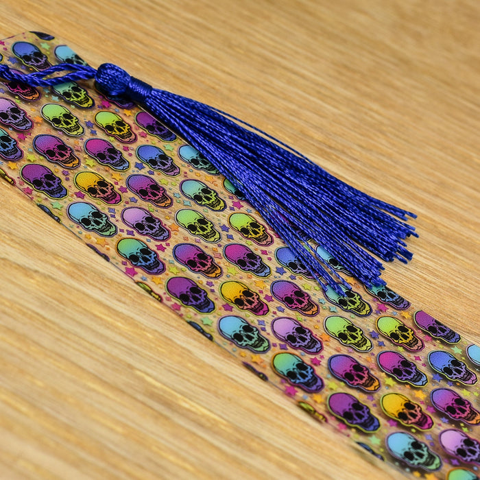 a tie with skulls and a tassel on a wooden table