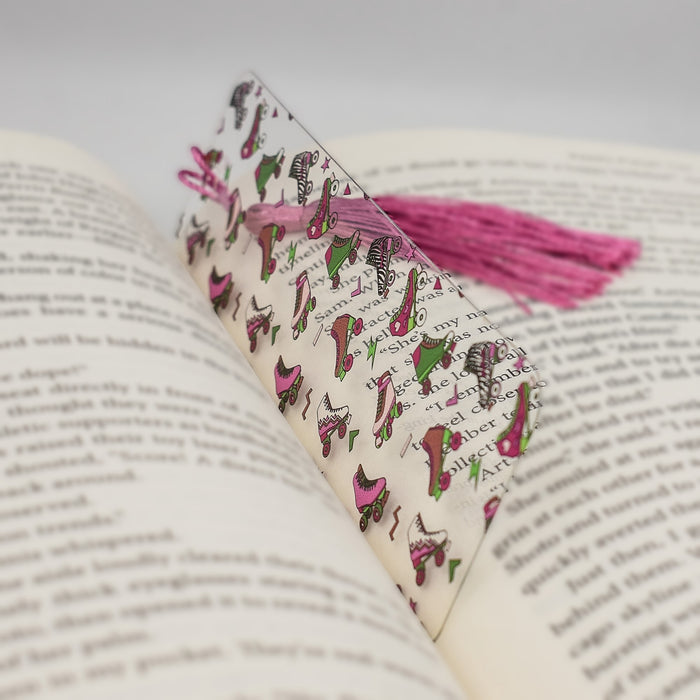 a book with a pink tassel on top of it