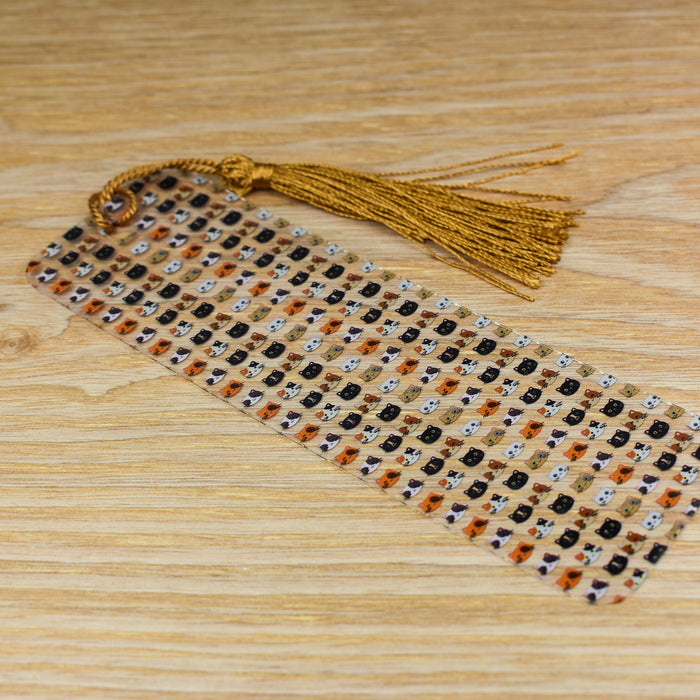 a beaded tie with a tassel on a wooden table