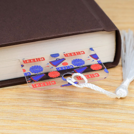 a close up of a book with a tassel on top of it