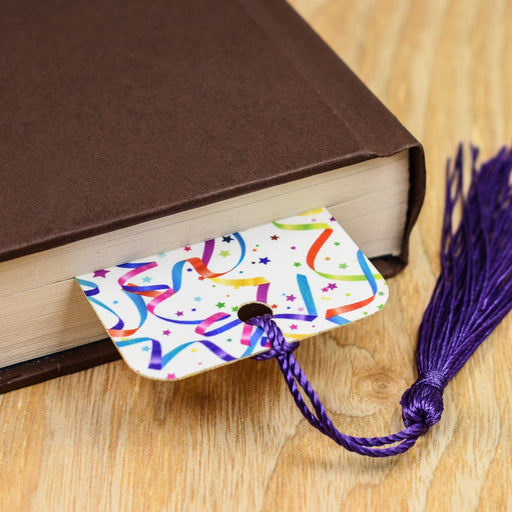 a book with a purple tassel on top of it