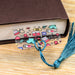 a book with a tassel on top of it