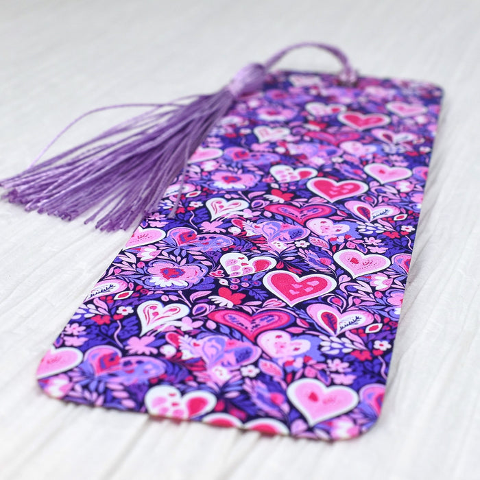 a purple and pink tie with hearts on it