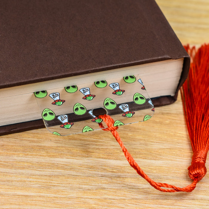 a book with stickers on it sitting on a table next to a tassel