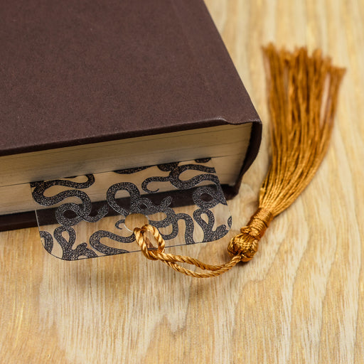 a book with a tassel on top of it