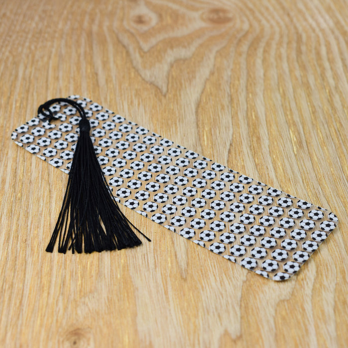 a tie with a black tassel on a wooden table