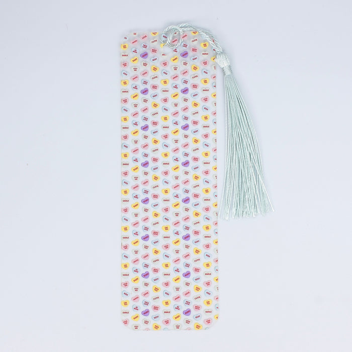 a bookmark with a tassel on top of it