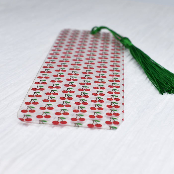 a red and white tie with cherries on it