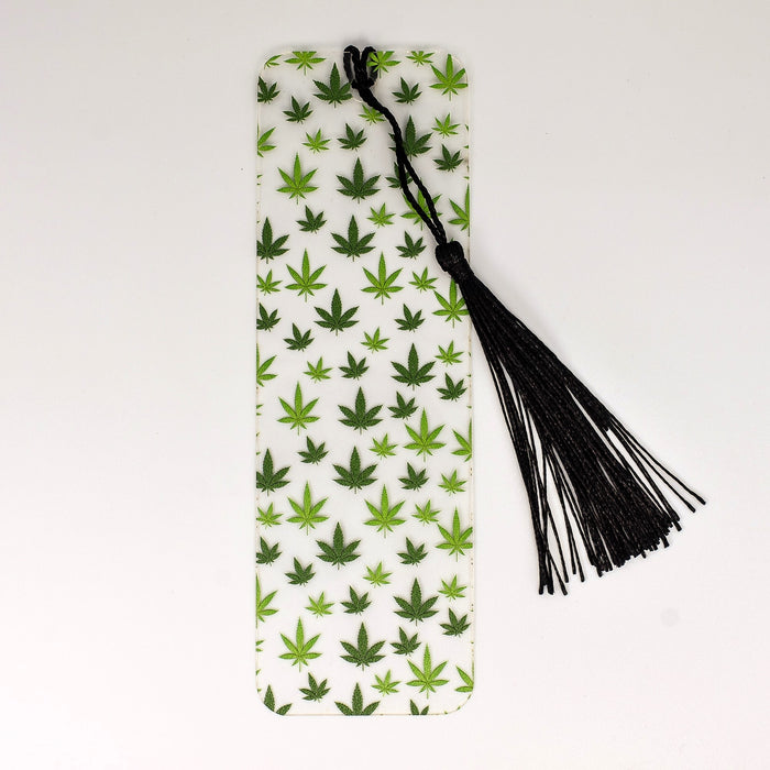 a bookmark with a marijuana leaf pattern and tassel